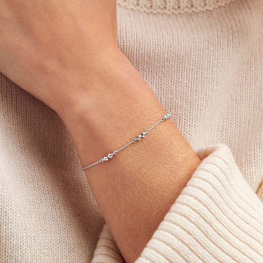 60th birthday diamond bracelet with 6 round diamonds in sterling silver on a dainty silver trace chain