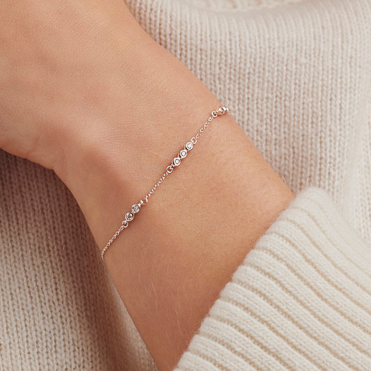 Diamond bracelet for 70th birthday gift with seven white diamonds on a delicate sterling silver trace chain