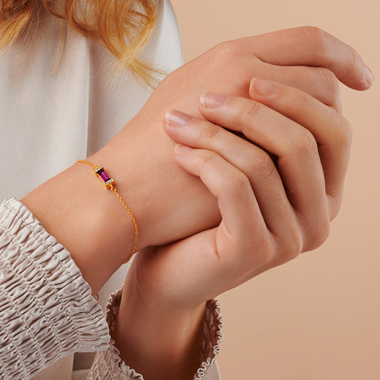 Purple amethyst baguette cut crystal birthstone bracelet set in gold vermeil with a fine 18 carat gold trace chain.