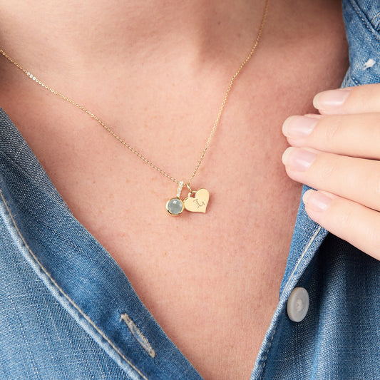 Faceted pale blue aquamarine gemstone pendant with diamonds and tiny heart initial charm in gold vermeil