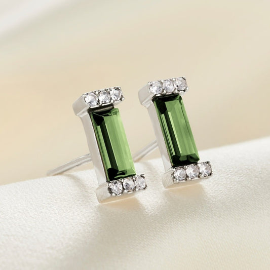 Sterling silver stud earrings with crystal pavé settings with a rectangular faceted baguette peridot crystal with post fittings.