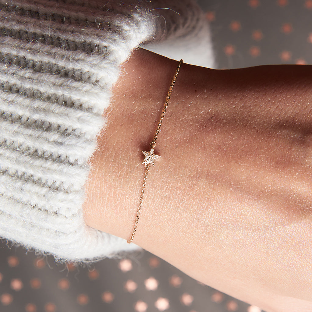 Diamond star bracelet in 18 carat gold vermeil set with tiny white diamonds. The bracelet is on a delicate gold vermeil trace chain by Claudette Worters.