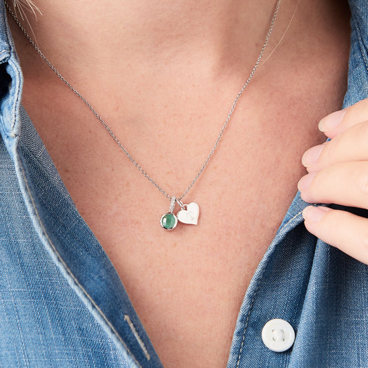 Emerald and diamond pendant necklace in silver with heart charm by Claudette Worters