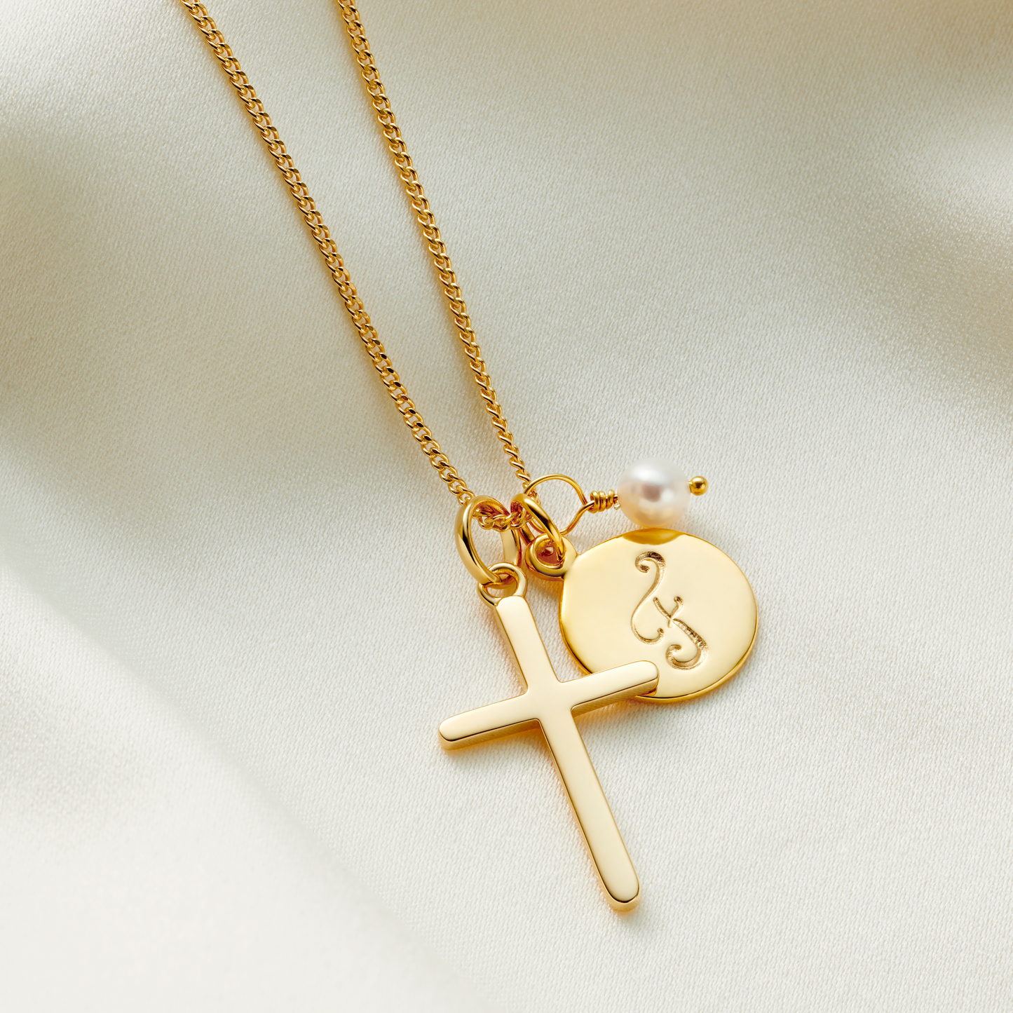 Gold cross necklace personalised with birthstones and initial charm
