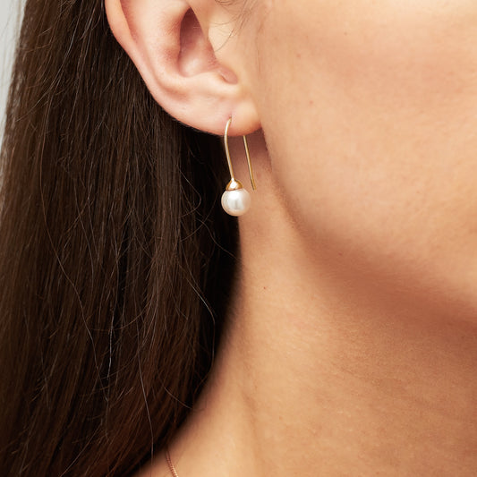 Ivory pearl drop earrings in 18 carat gold vermeil by Claudette Worters