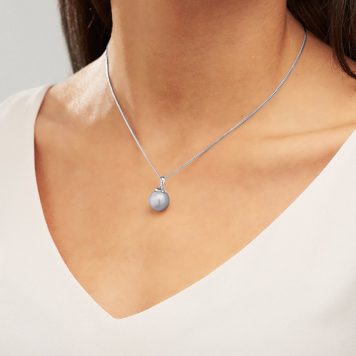 Single grey pearl pendant necklace in silver by Claudette Worters