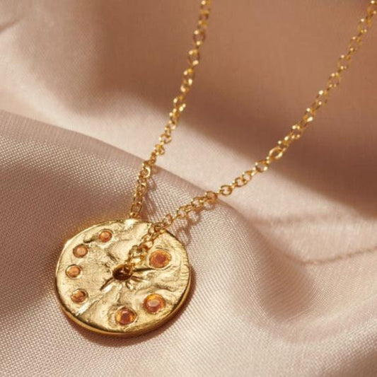 November birthstone spinner necklace set with faceted citrine gemstones  in 18 carat gold vermeil, hung on a dainty gold trace chain.