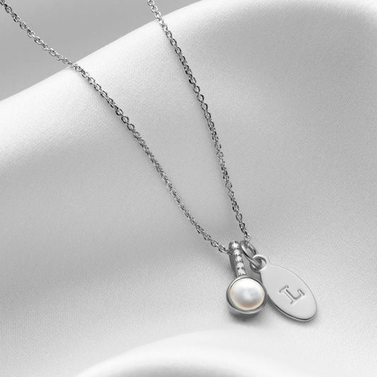 White pearl pendant with real diamonds and personalised initial charm in sterling silver by Claudette Worters