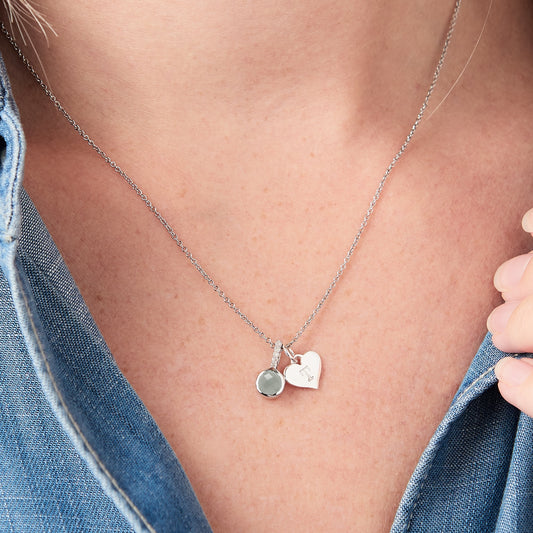 Pale blue aquamarine necklace with white diamonds in silver with a heart charm