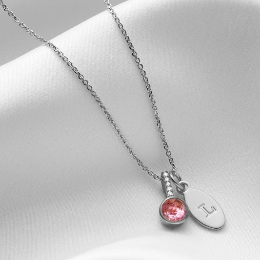 Pink Tourmaline October birthstone pendant necklace in silver with tiny white diamonds and oval initial charm