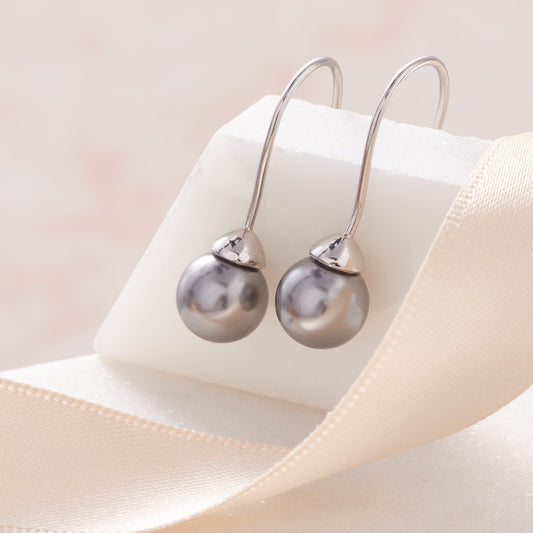 Grey pearl earrings on long sterling silver hook wires by Claudette Worters