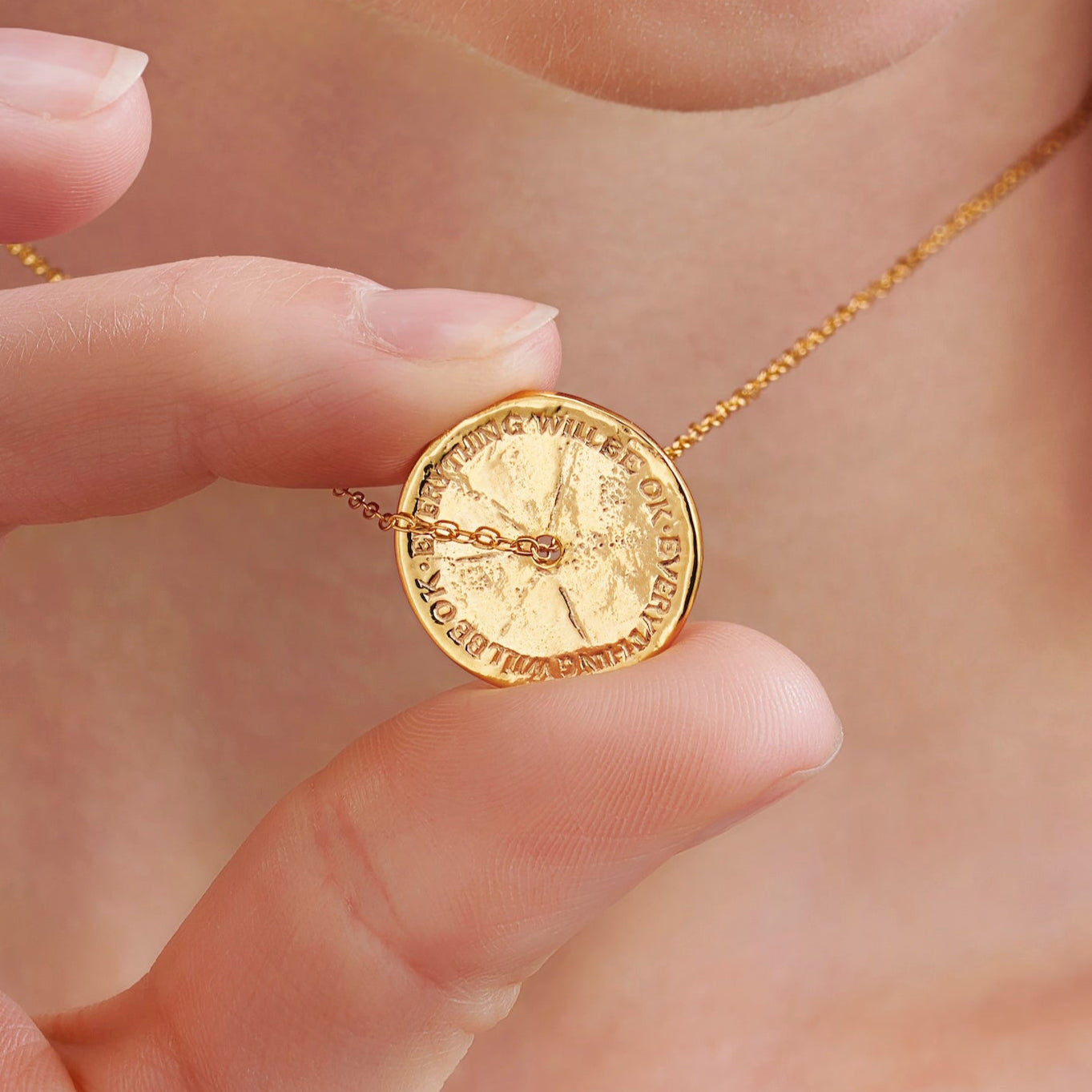 Gold anti anxiety necklace with spinner disc pendant on a fine trace chain by Claudette Worters