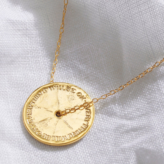 Anxiety necklace with spinner disc pendant in gold.