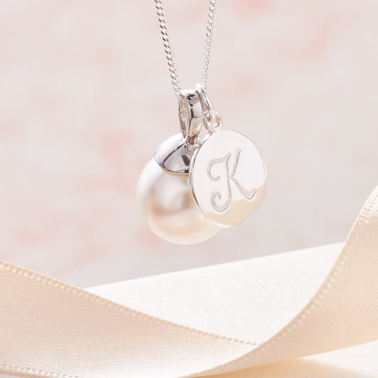Large white pearl pendant with personalised initial charm in sterling silver