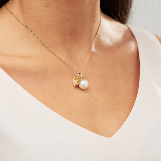 Ivory pearl pendant necklace with personalised gold initial charm by Claudette Worters
