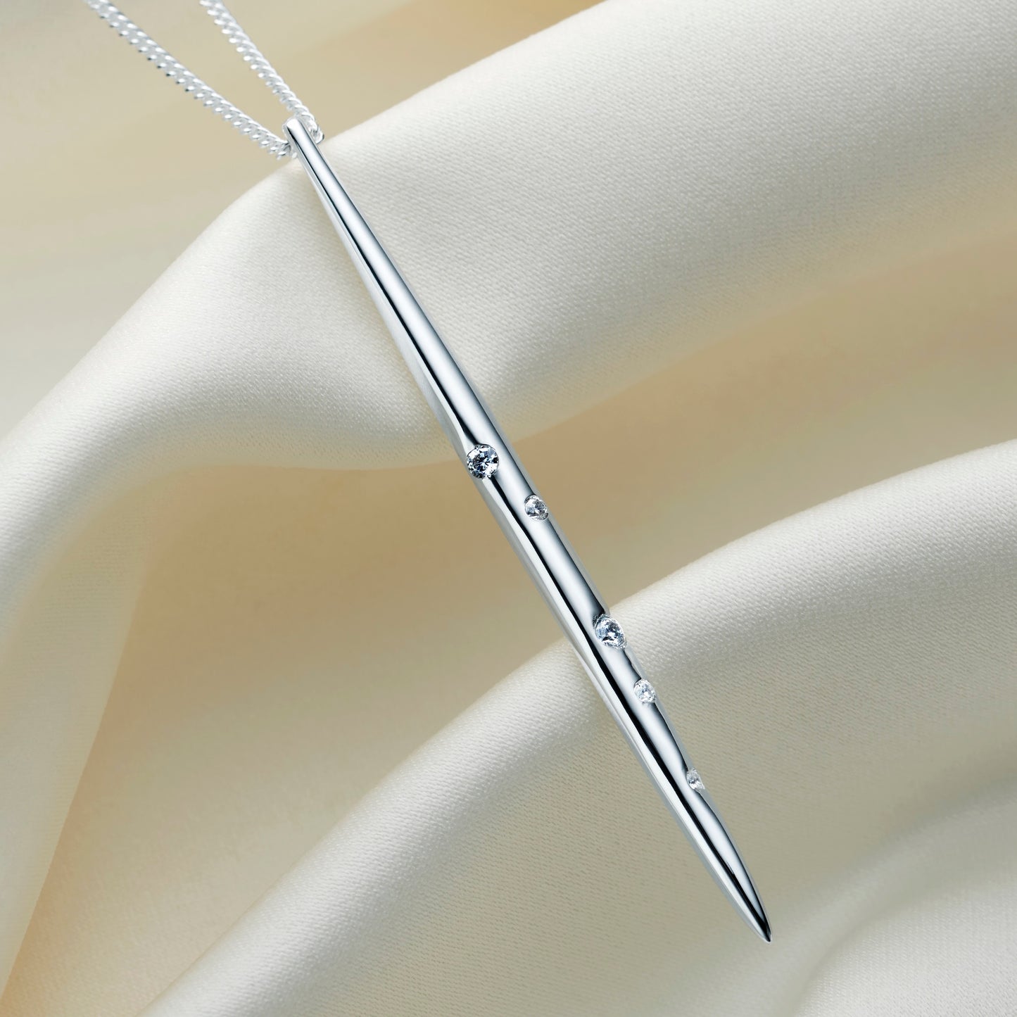 Silver spike pendant with the zodiac constellation of Cancer depicted in little white Swarovski crystals on a fine sterling silver chain.