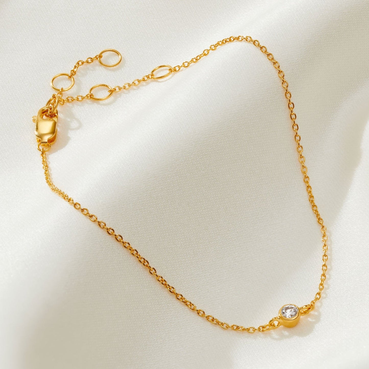 21st birthday diamond bracelet with single diamond on a fine gold trace chain