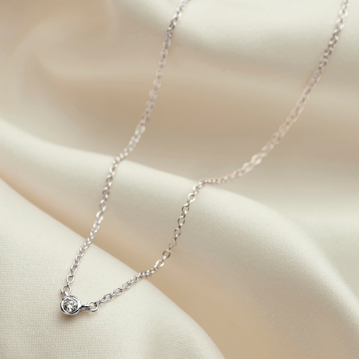 Single solitaire diamond necklace for 21st birthday in silver on a fine trace chain by Claudette Worters