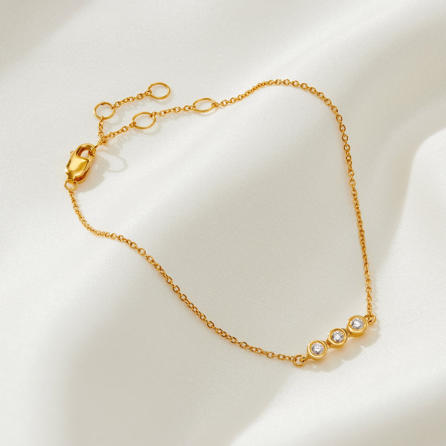 30th birthday diamond bracelet in gold vermeil with a trio of diamonds to represent 3 decades 