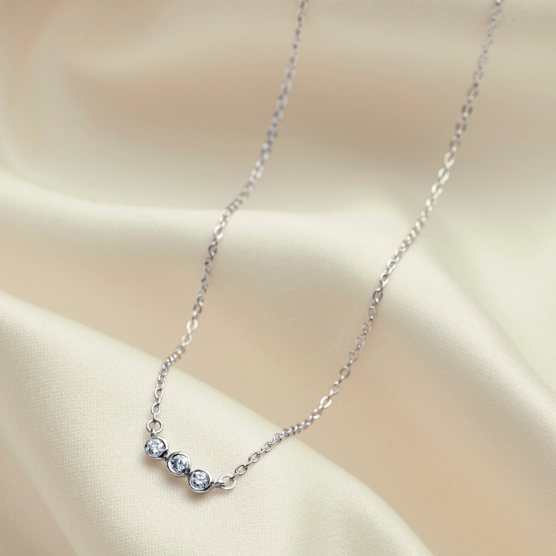 30th birthday diamond necklace with three round diamonds in sterling silver