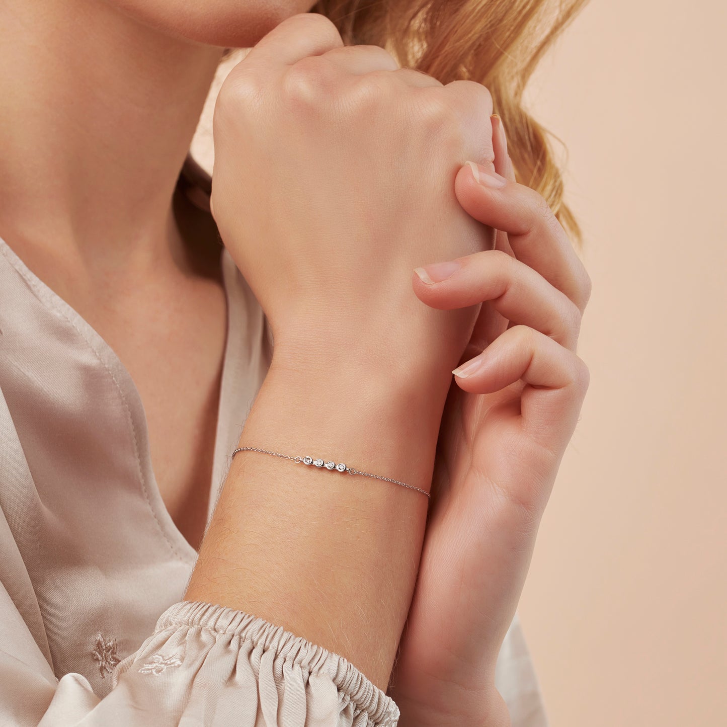 40th birthday diamond bracelet with 4 diamonds in a rub over setting on a dainty sterling silver trace chain