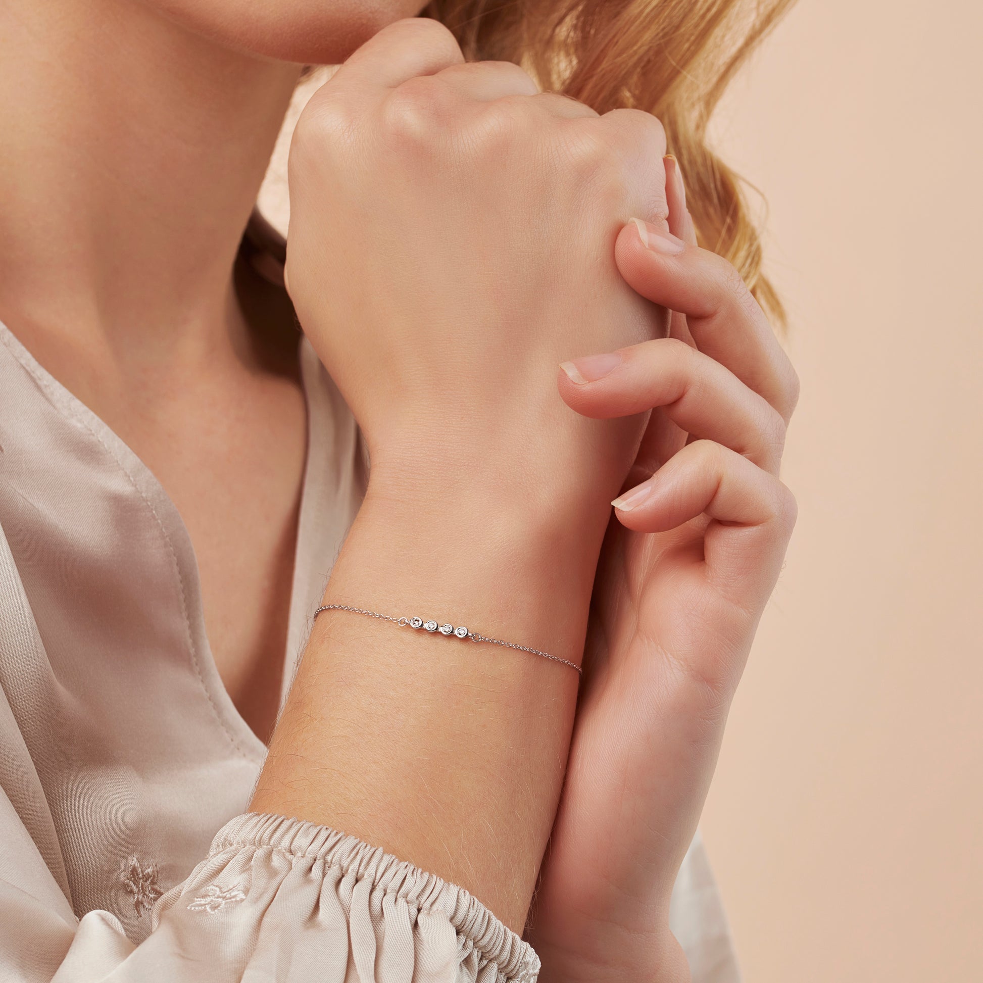 40th birthday diamond bracelet with 4 diamonds in a rub over setting on a dainty sterling silver trace chain