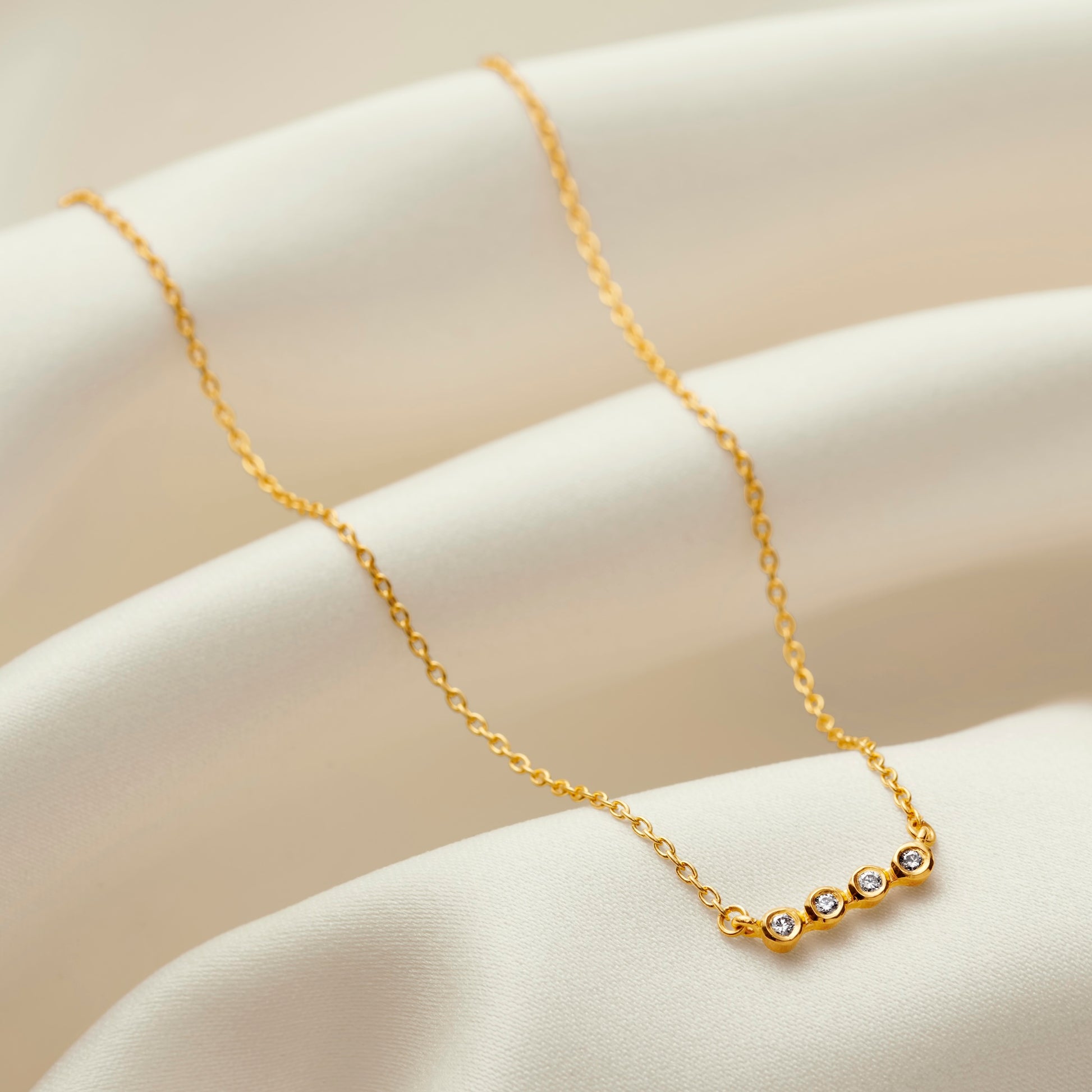 40th birthday diamond necklace with four bezel set diamonds in gold vermeil 