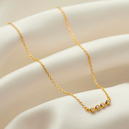 40th birthday diamond necklace with four bezel set diamonds in gold vermeil 
