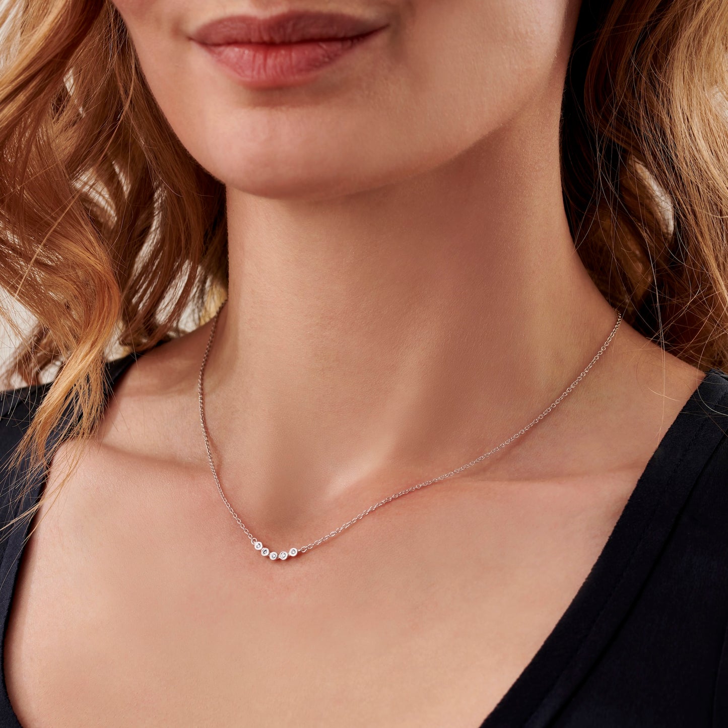 Sterling silver necklace with 5 diamonds to represent 5 decades by Claudette Worters
