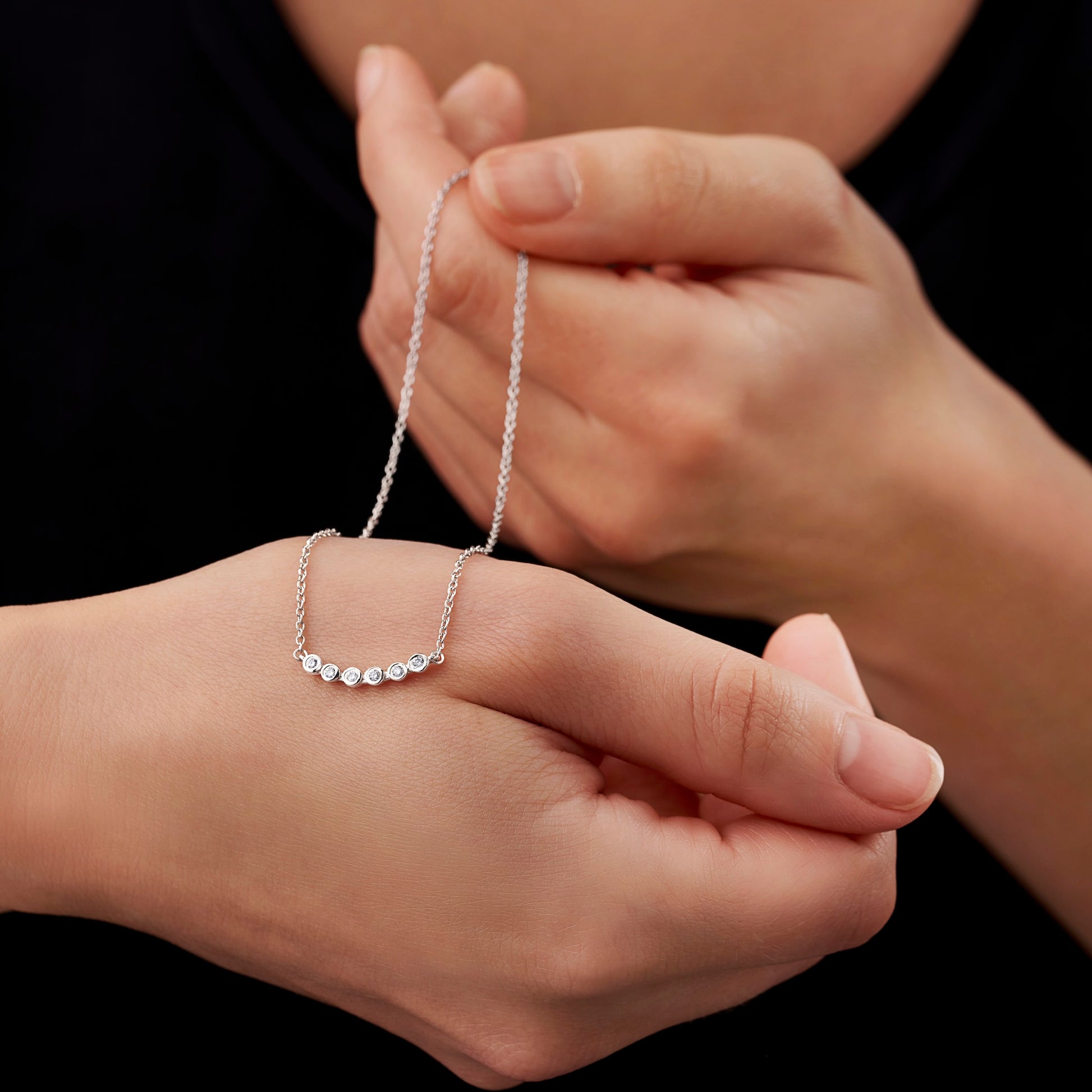 60th birthday diamond necklace with 6 white round diamonds on a dainty sterling silver chain