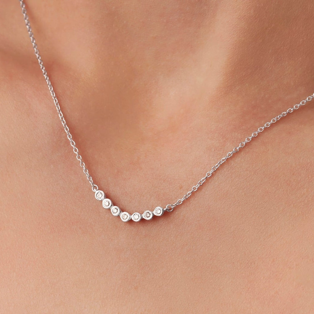 7 diamonds for 7 decades necklace in sterling silver by Claudette Worters