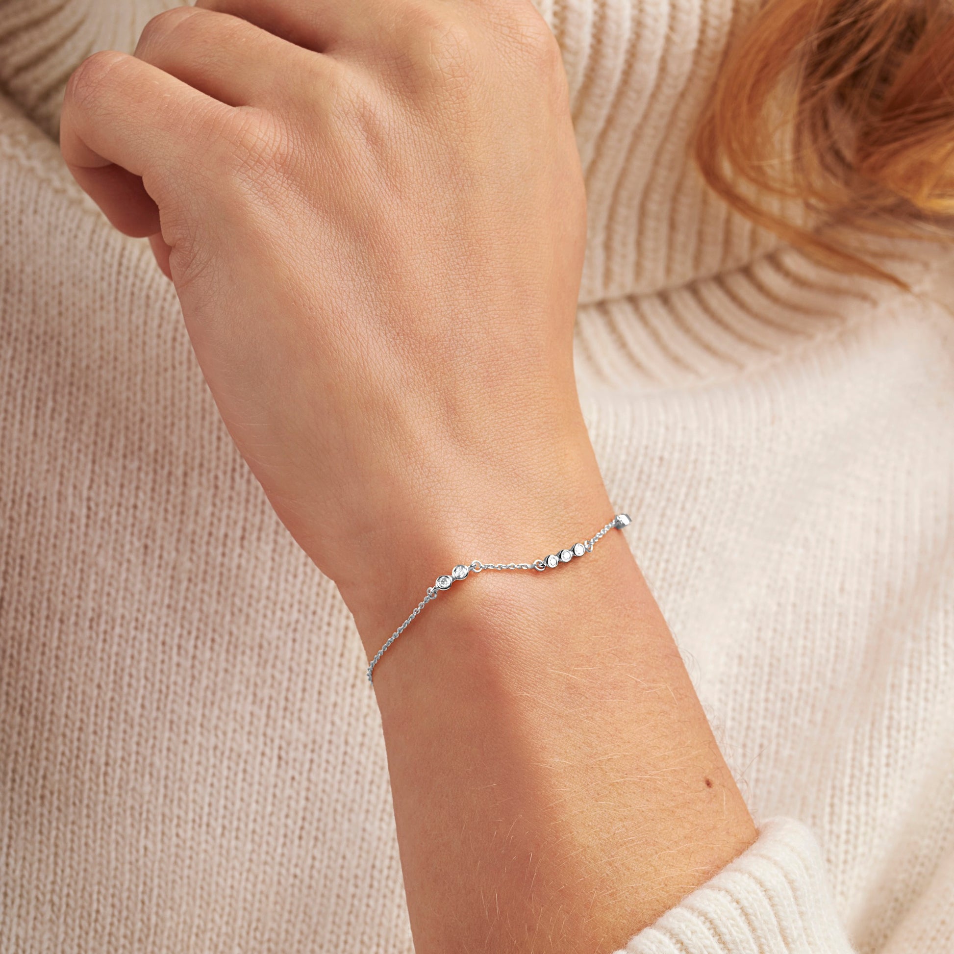 70th birthday diamond bracelet with 7 diamonds for each decade in sterling silver by Claudette Worters
