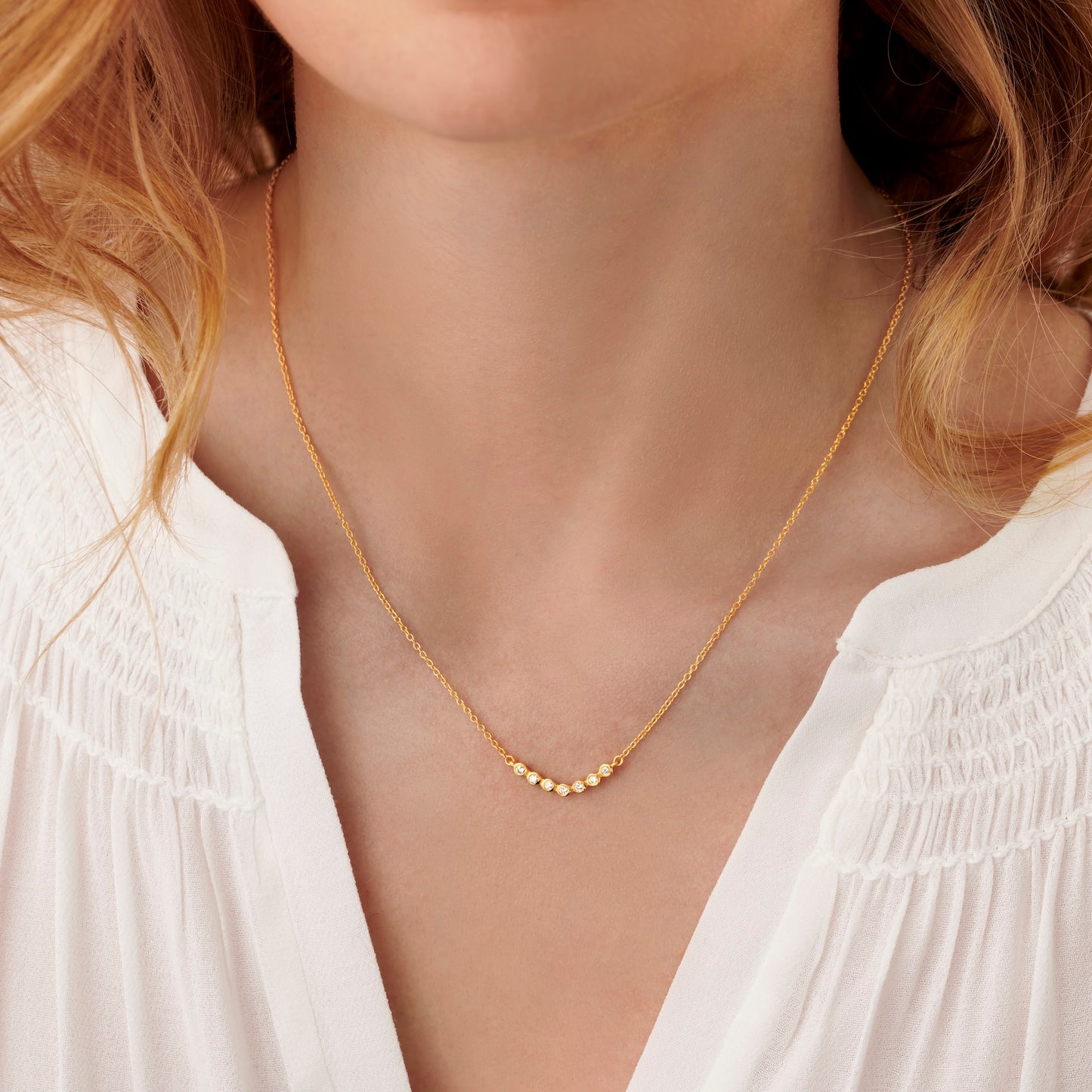 70th birthday gold necklace with 7 diamonds to represent 7 decades in 18 carat gold vermeil on a fine trace chain