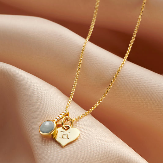 Aquamarine birthstone necklace in gold with letter charm by Claudette Worters