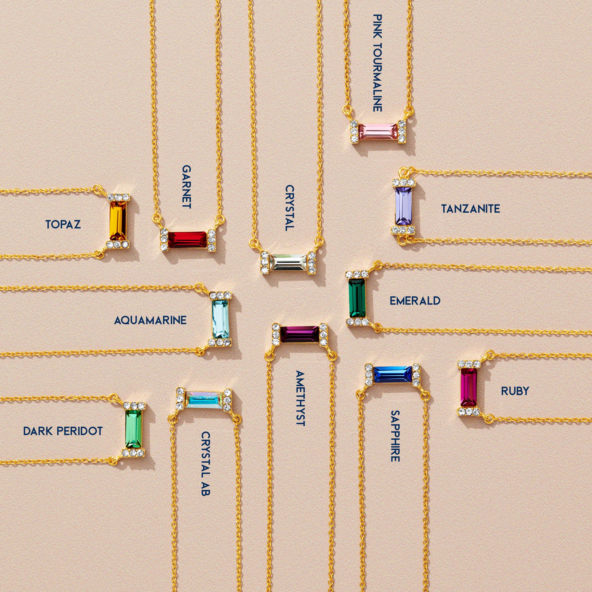 12 coloured baguette birthstone necklaces in gold by Claudette Worters