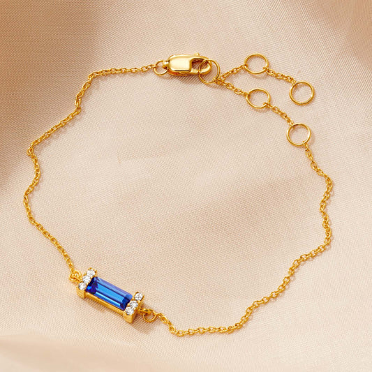 Sapphire baguette birthstone bracelet in gold