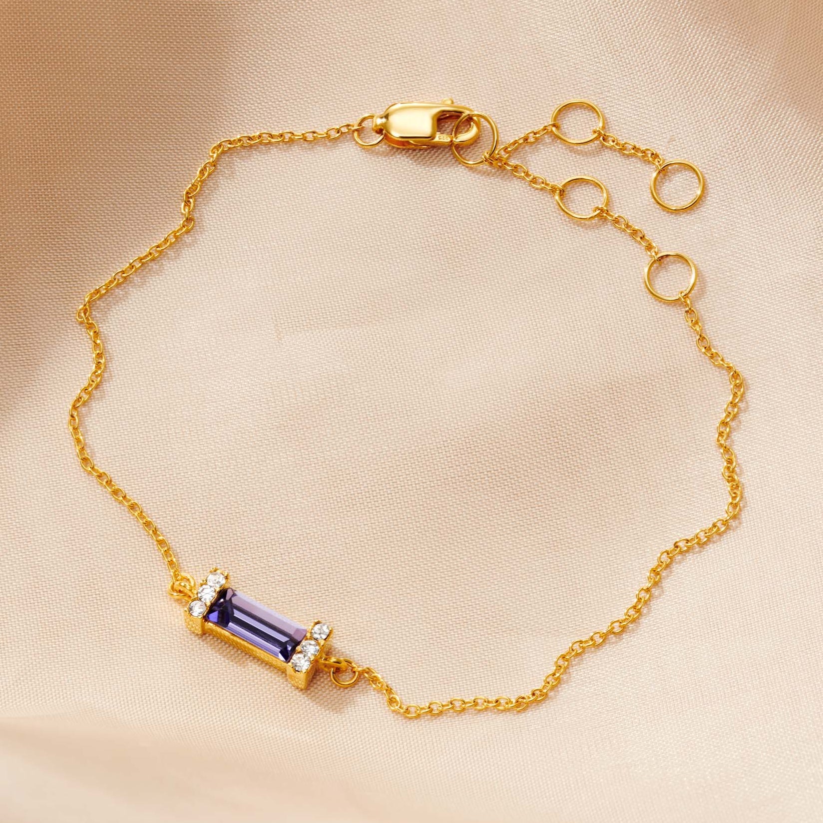 December birthstone bracelet with tanzanite baguette gemstone in 18 carat gold vermeil by Claudette Worters Jewellery.