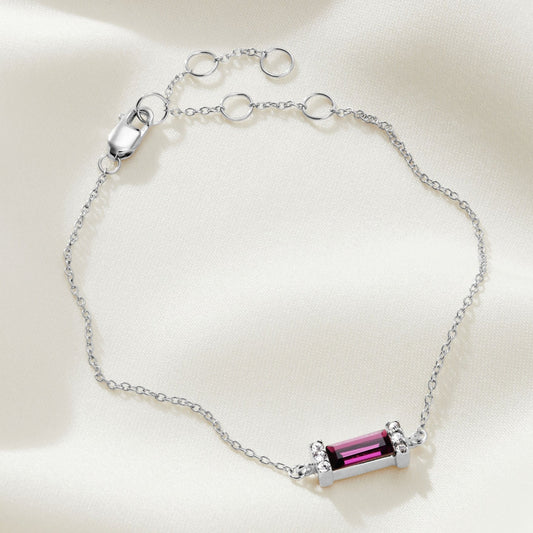 Sterling silver bracelet with a faceted baguette shaped Amethyst crystal in a pavé setting on a dainty adjustable trace chain.