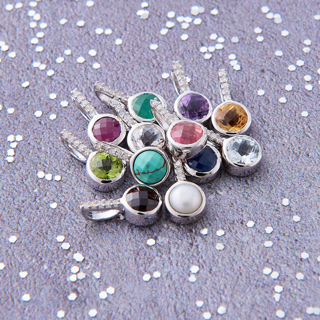 Diamond birthstone pendants in silver by Claudette Worters