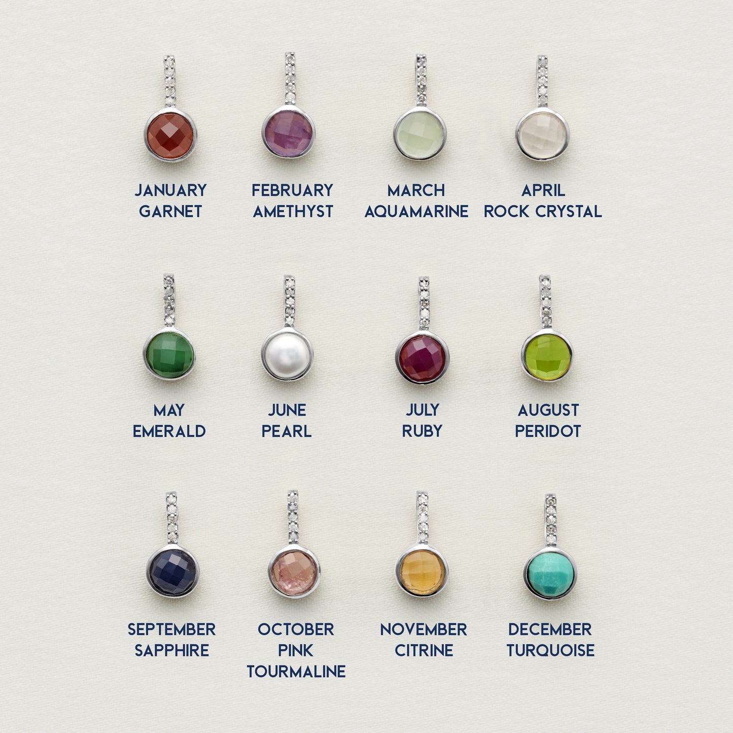 12 semi precious birthstone pendants by Claudette Worters Jewellery.  They're round, faceted with tiny diamonds in the bale and are set in sterling silver.