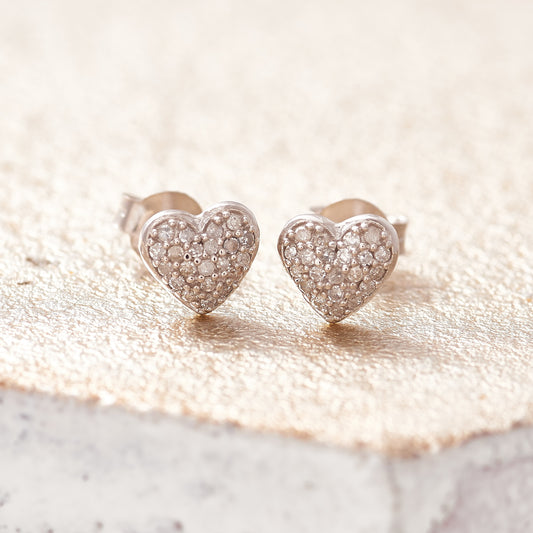 Sterling silver heart stud earrings pavé set with tiny white diamonds by Claudette Worters.