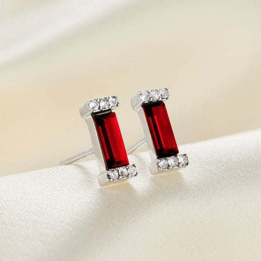 Sterling silver stud earrings with red garnet crystal baguette stones in sterling silver pavé settings