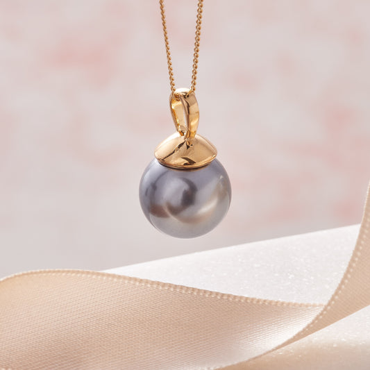 Dark grey single pearl pendant in an 18 carat yellow gold vermeil setting on a fine gold vermeil chain