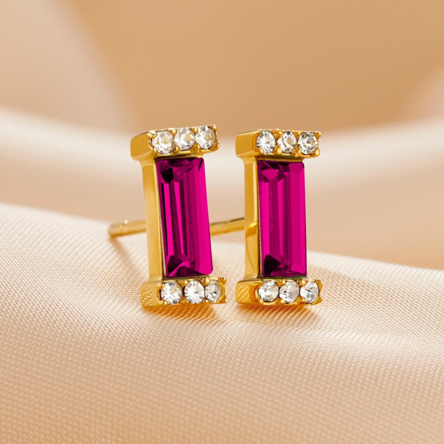 Ruby baguette birthstone gold stud earrings for July birthday by Claudette Worters.