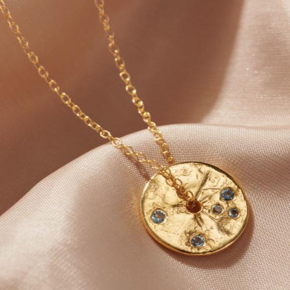 March Aquamarine birthstone spinner necklace in gold vermeil with little pale blue faceted aquamarine stones.