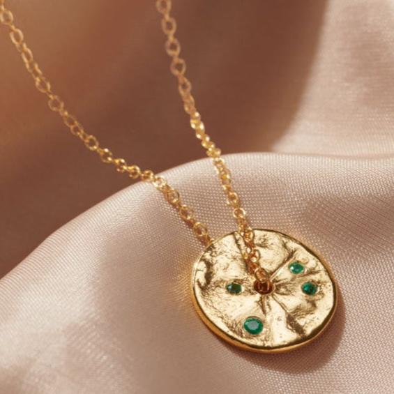 Emerald birthstone disc pendant in gold vermeil on a dainty gold trace chain by Claudette Worters