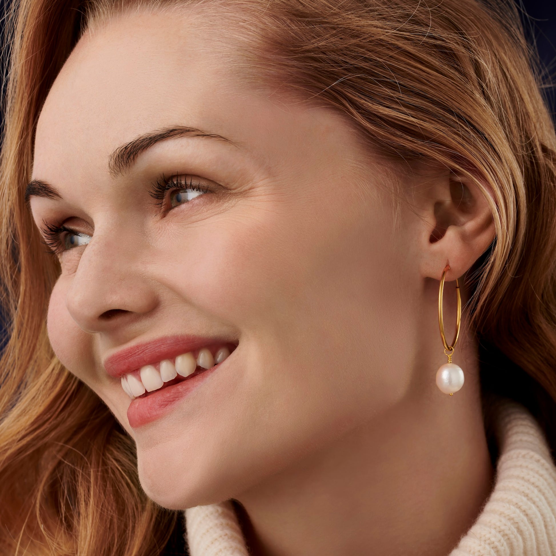 Large gold hoop earrings with freshwater pearls