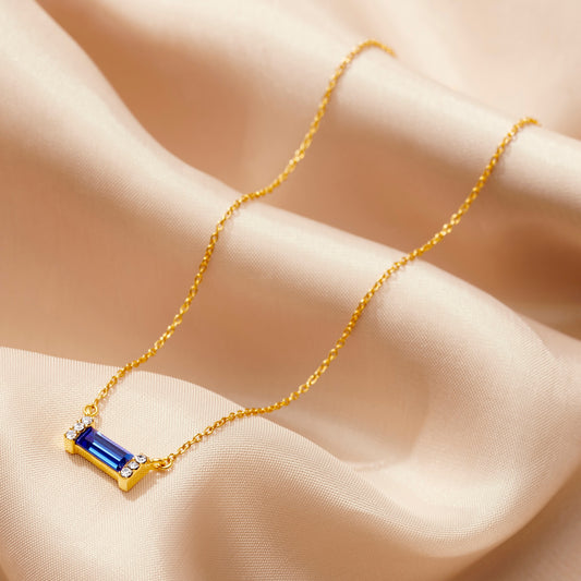 Sapphire birthstone baguette necklace in gold