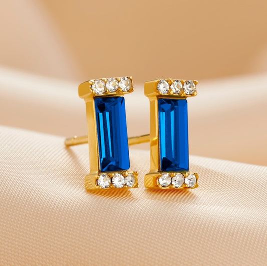 Sapphire baguette cut stone stud earrings in gold