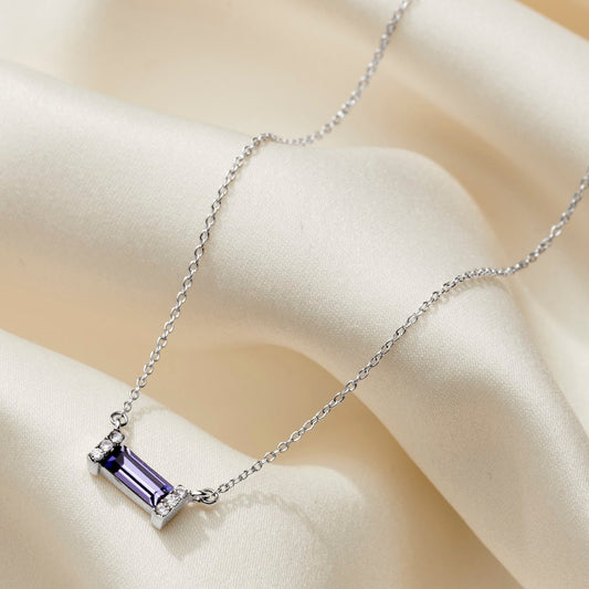 Purple tanzanite baguette shaped crystal necklace in a pavé sterling silver setting on an elegant fine sterling silver trace chain.